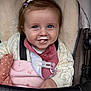 baby, child, smiling, milk_mustache, stroller, blanket, blue_eyes, hair_clip, knitted_sweater, cozy, cute, infant, happy, portrait, baby_bib, closeup, person, seatbelt, pink, soft