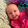 Raven is registered to the contest to win money with this photo: accessories, baby, ball, blanket, clothing, coat, cushion, face, glasses, happy, head, homedecor, jacket, newborn, person, photography, portrait, purple, quilt, smile