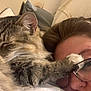 Toby is registered to the contest to win money with this photo: cat, tabby_cat, sleeping, paw, person, glasses, face, pillow, bed, indoor, cozy, relaxation, closeup, fur, resting, cute, pet, companion, human, intimate