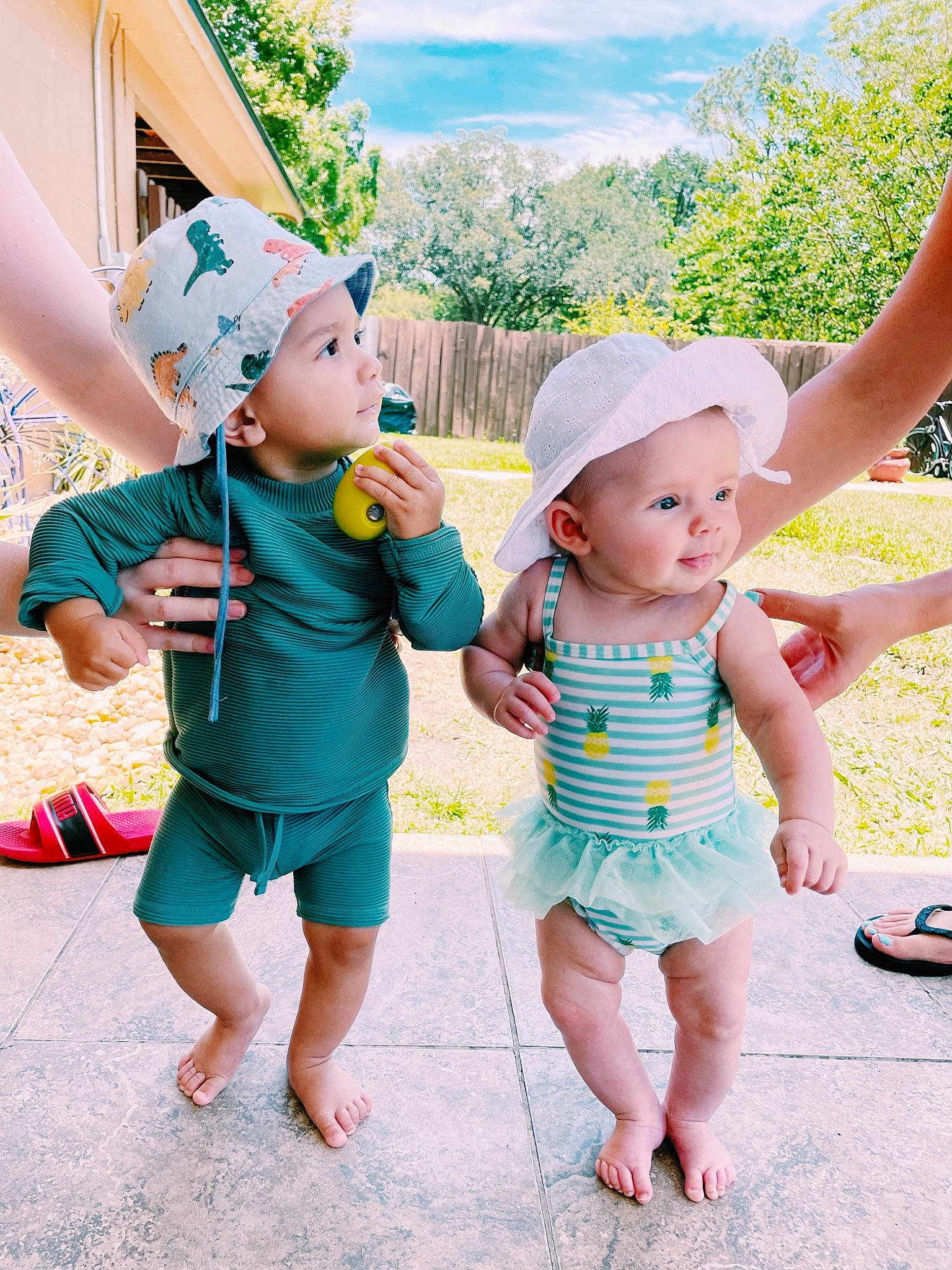 Atlas joined the competition — help win amazing prizes! baby, baby_toddler_clothing, facial_expression, gesture, grass, hand, happy, hat, headwear, interaction, leisure, mammal, person, pink, plant, product, skin, sky, sun_hat, textile
