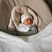 Deetya joined the competition — help win amazing prizes! baby, newborn, sleeping, hat, blanket, baby_seat, cozy, soft, peaceful, infant, clothing, indoors, child, cute, resting, portrait, wrapped, comfort, headwear, fabric