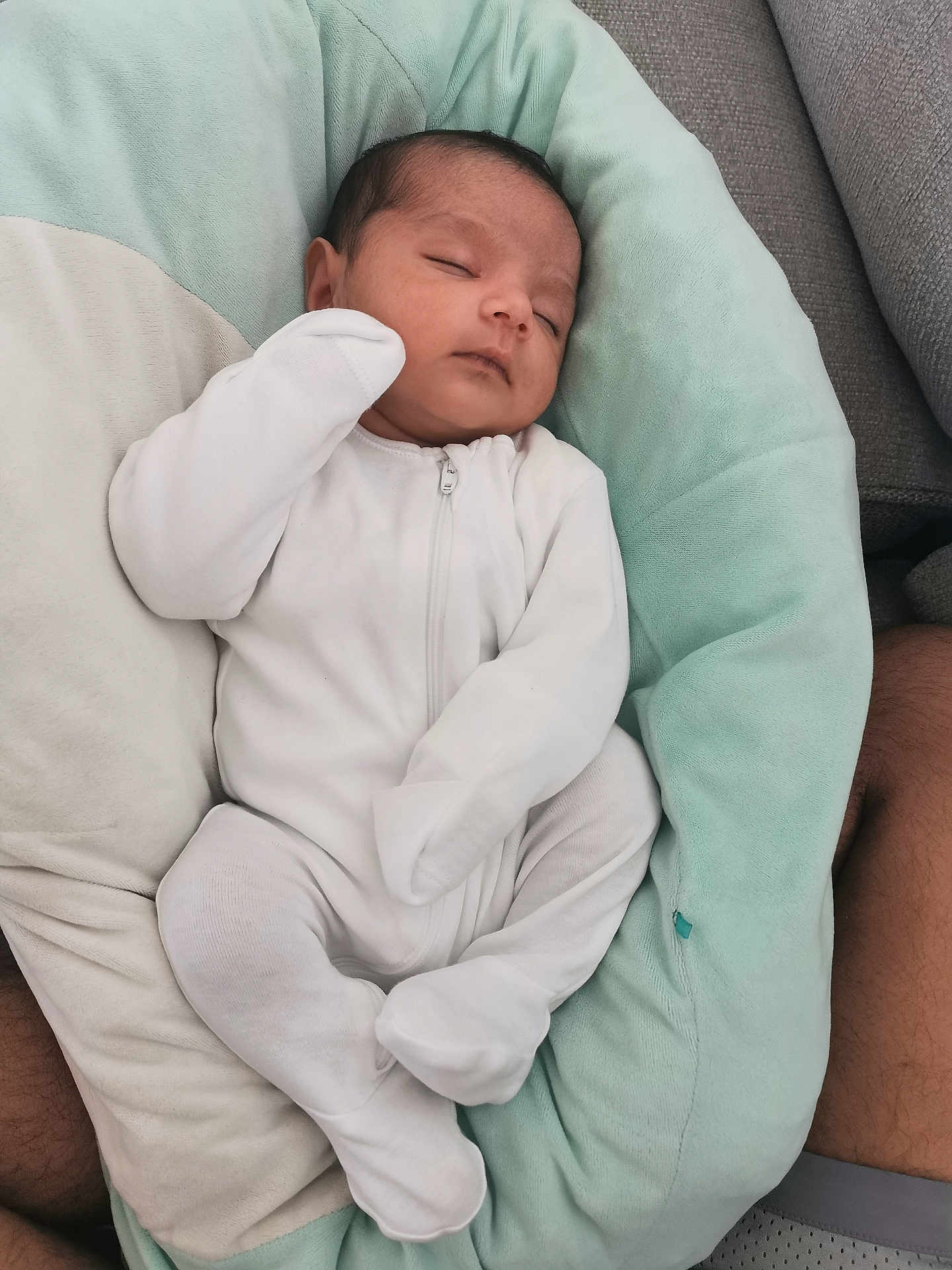 Deetya is registered to the contest to win money with this photo: baby, newborn, sleeping, infant, white_clothing, onesie, cushion, soft_texture, comfort, peaceful, resting, closeup, indoor, person, child, cute, small, head, face, human