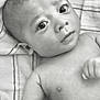 baby, infant, face, eyes, skin, arm, hand, towel, black_and_white, portrait, lying_down, young_child, curious, expression, close_up, newborn, person, child, indoors, soft_light