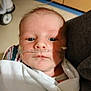 James is registered to the contest to win money with this photo: baby, newborn, hospital, oxygen_tube, blanket, infant, face, medical, patient, child, person, healthcare, closeup, wrapped, bed, resting, skin, indoors, treatment, care