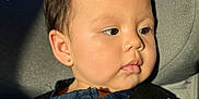 Aysha joined the competition — help win amazing prizes! baby, child, portrait, denim, seatbelt, car_seat, sunlight, closeup, face, skin, earring, black_straps, clothing, young_child, indoors, seat, cute, infant, safety, serene