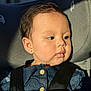 baby, child, portrait, denim, seatbelt, car_seat, sunlight, closeup, face, skin, earring, black_straps, clothing, young_child, indoors, seat, cute, infant, safety, serene