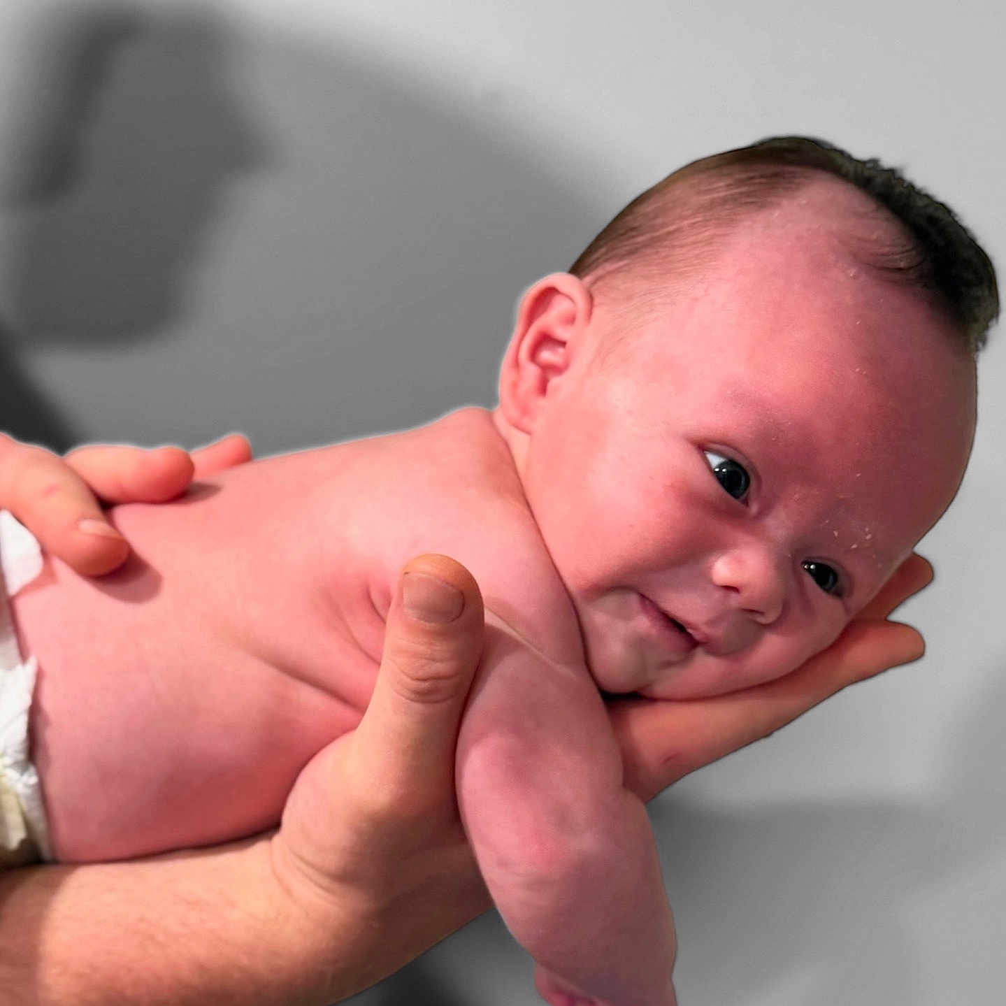 Crisnie joined the competition — help win amazing prizes! baby, child, closeup, cute, diaper, expression, face, hand, holding, human, infant, naked_torso, newborn, person, portrait, resting, shadow, skin, soft_light, young