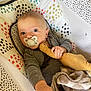 Wilbur joined the competition — help win amazing prizes! baby, pacifier, plush_toy, blanket, baby_seat, infant, person, cute, hand, face, clothing, patterned, gray_clothing, toy, comfort, indoor, child, young_baby, looking, resting