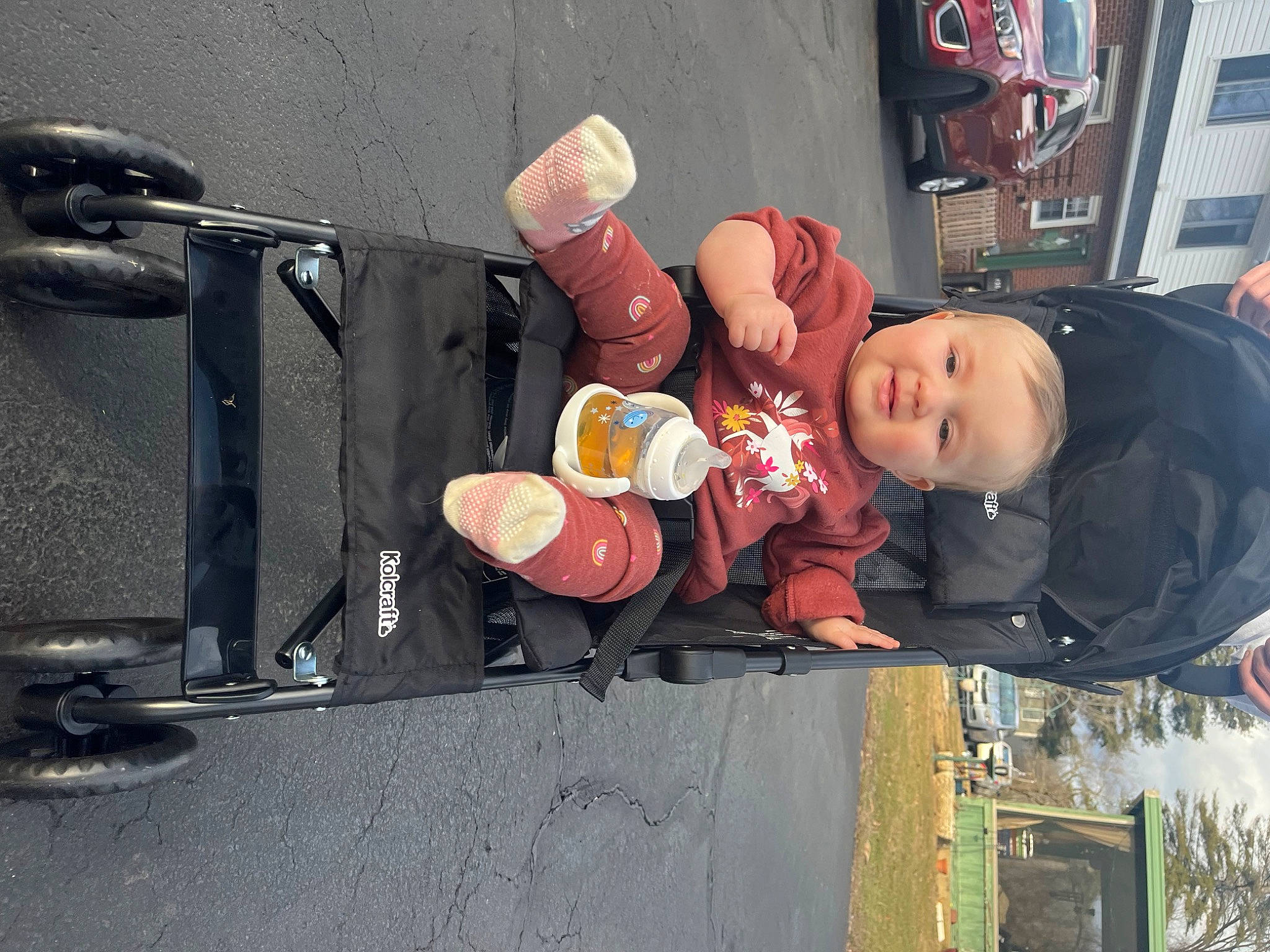 Aubrey joined the competition — help win amazing prizes! art, asphalt, audio_equipment, auto_part, boot, child, fun, gas, hat, motor_vehicle, person, sitting, street, tire, toddler, toy, winter