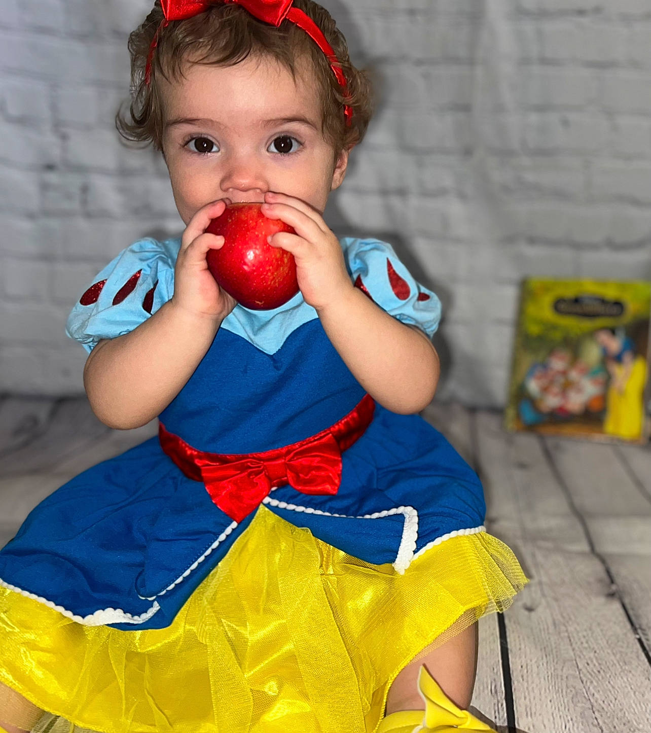 Fallon joined the competition — help win amazing prizes! baby, baby_toddler_clothing, baby_toys, child, dress, event, eye, facial_expression, fruit, fun, happy, natural_foods, orange, person, pink, plant, play, red, sitting, toddler