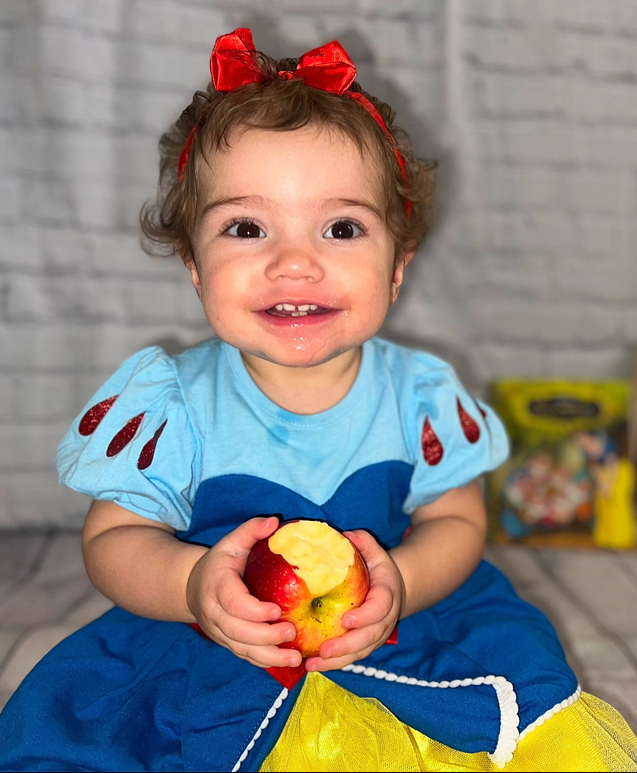 Fallon is registered to the contest to win money with this photo: arm, baby, baby_toddler_clothing, child, dress, eye, facial_expression, finger, hair, hairstyle, happy, head, iris, joy, person, pink, plant, skin, sleeve, smile