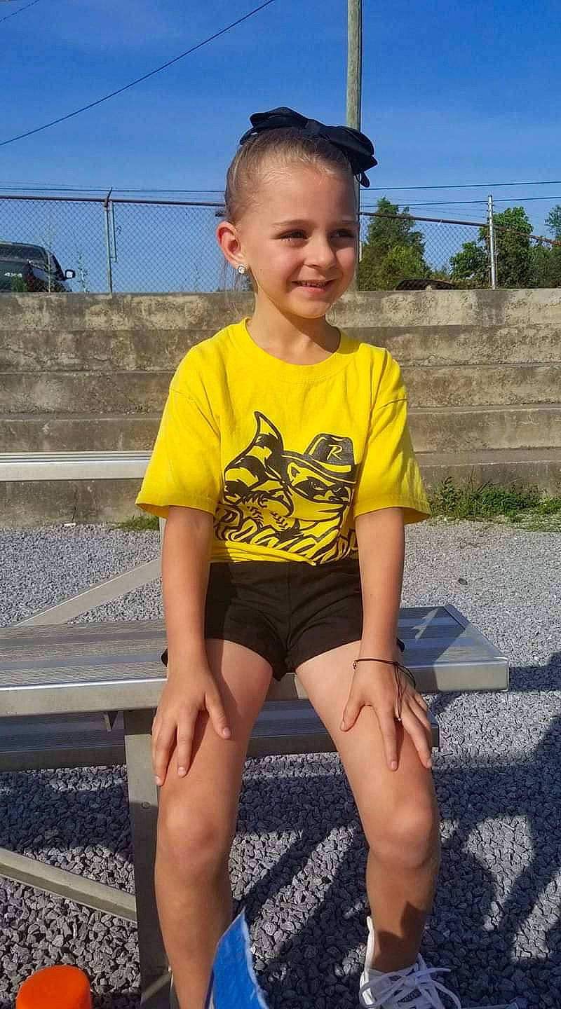 Abigail joined the competition — help win amazing prizes! child, child_model, joy, leg, person, shorts, sitting, smile, sportswear, summer, t_shirt, thigh, toddler, vacation, yellow