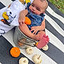 autumn, baby, blanket, bucket, child, cute, denim_overalls, fall, festive, foot, grass, hand, holiday, infant, mini_pumpkin, outdoor, person, pumpkin, relaxed, striped_mat