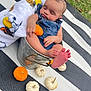 Tommy James joined the competition — help win amazing prizes! autumn, baby, blanket, bucket, child, cute, denim_overalls, fall, foot, grass, hand, infant, mini_pumpkins, nature, outdoor, peaceful, portrait, pumpkin, sleeping, striped_mat