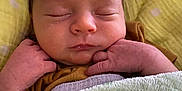 Benny Love is registered to the contest to win money with this photo: baby, newborn, sleeping, blanket, hands, face, infant, cozy, peaceful, cute, child, rest, soft, wrapped, toddler, skin, human, portrait, indoors, comfort