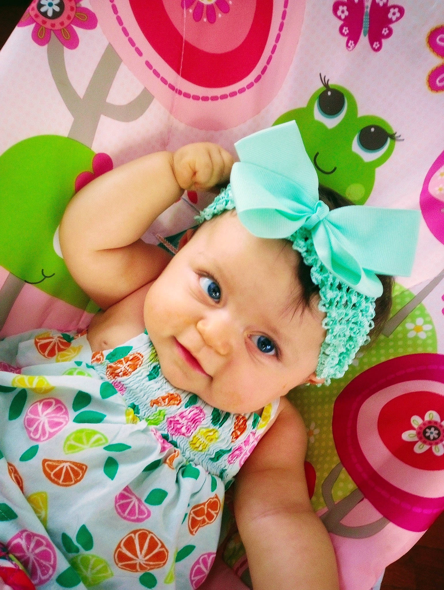 Madyson is registered to the contest to win money with this photo: baby, baby_toddler_clothing, cap, child, costume_hat, event, fashion_accessory, fun, green, happy, hat, headgear, headwear, magenta, person, pink, product, sleeve, smile, sweetness