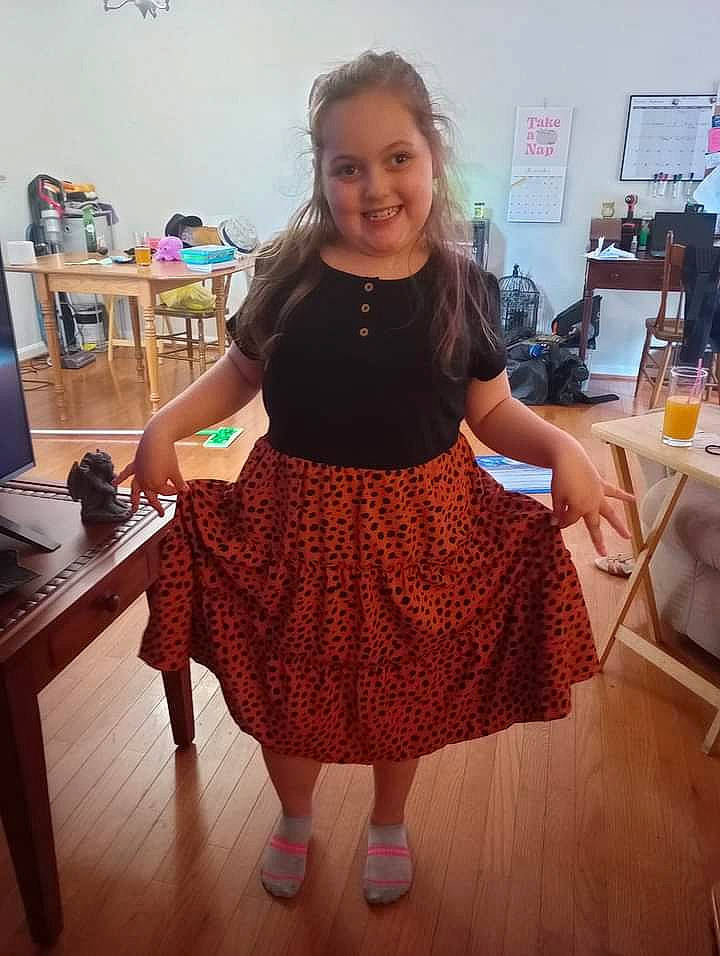 Jade joined the competition — help win amazing prizes! fashion_design, floor, flooring, fun, happy, hardwood, human_leg, joint, joy, knee, long_hair, pattern, person, shoulder, sleeve, smile, standing, table, thigh, trunk