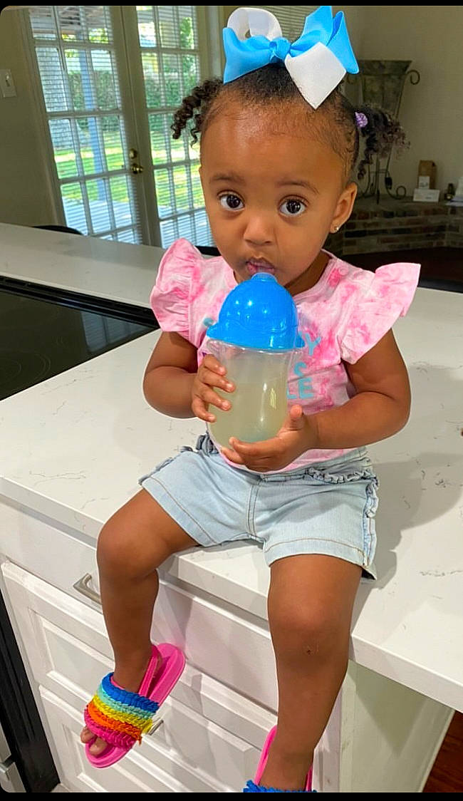 Makana joined the competition — help win amazing prizes! baby_playing_with_toys, baby_toddler_clothing, blue, child, drinkware, fun, goggles, happy, leg, leisure, person, pink, plastic_bottle, shorts, skin, standing, surprise, t_shirt, thigh, toddler