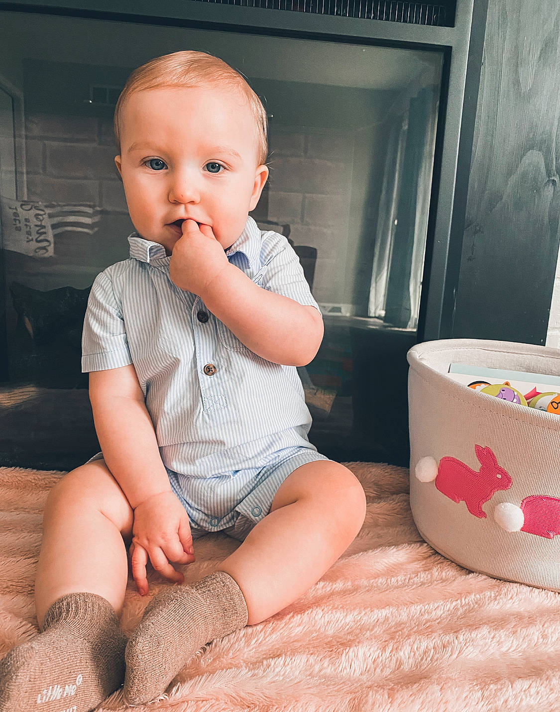 Christopher is registered to the contest to win money with this photo: baby_toddler_clothing, cheek, child, comfort, facial_expression, finger, floor, flooring, human_leg, joint, knee, leg, person, pink, product, shorts, shoulder, skin, sleeve, thigh
