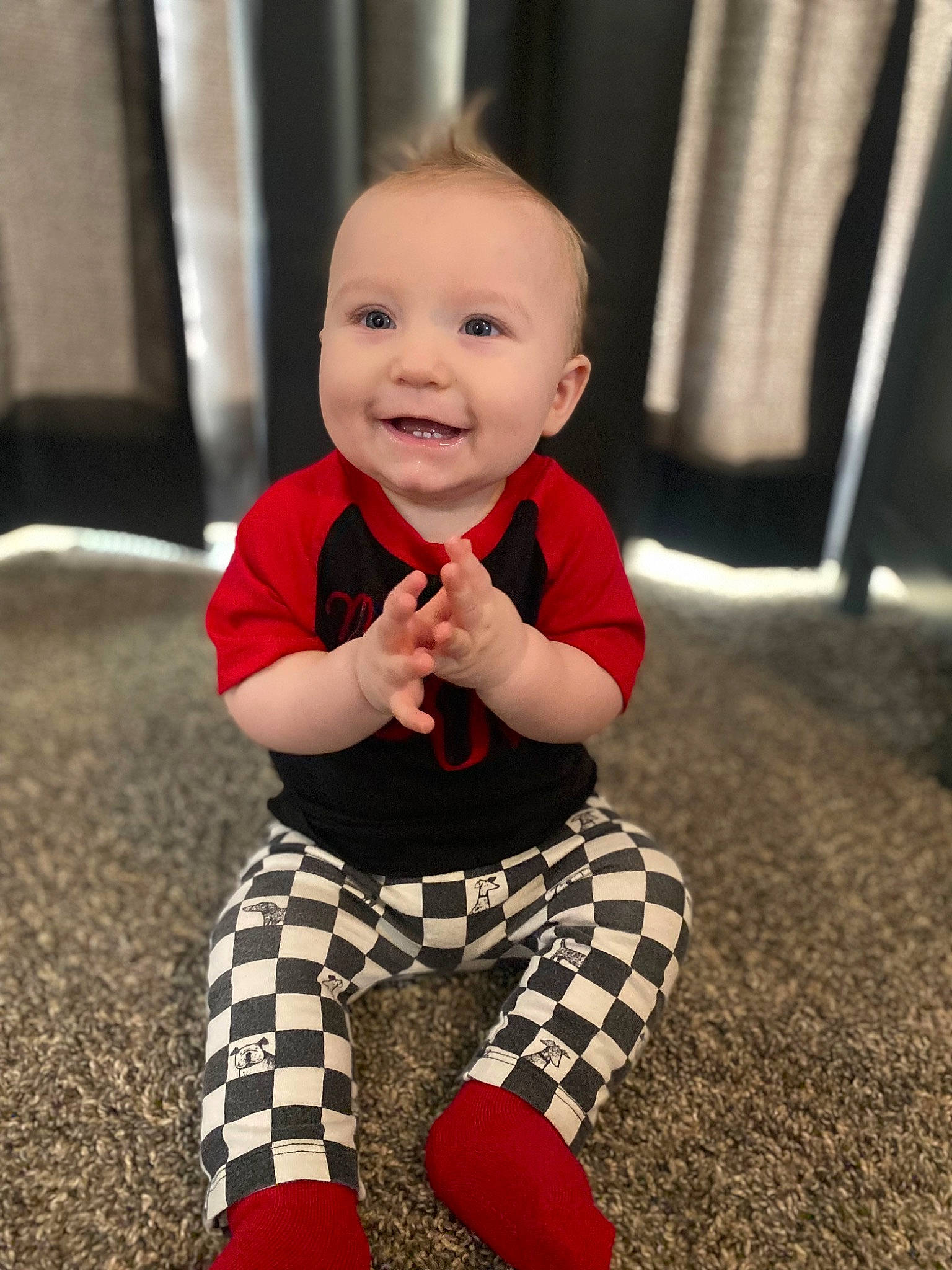 Christopher joined the competition — help win amazing prizes! baby, baby_toddler_clothing, child, face, flooring, fun, happy, head, human_leg, joy, knee, pajamas, pattern, person, plaid, sitting, sleeve, smile, sock, t_shirt