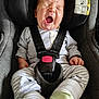 baby, car_seat, yawning, infant, child, safety_harness, clothing, striped_pants, socks, indoors, cute, sleepy, seat_belt, closeup, person, child_seat, head_support, infant_clothing, baby_gear, resting