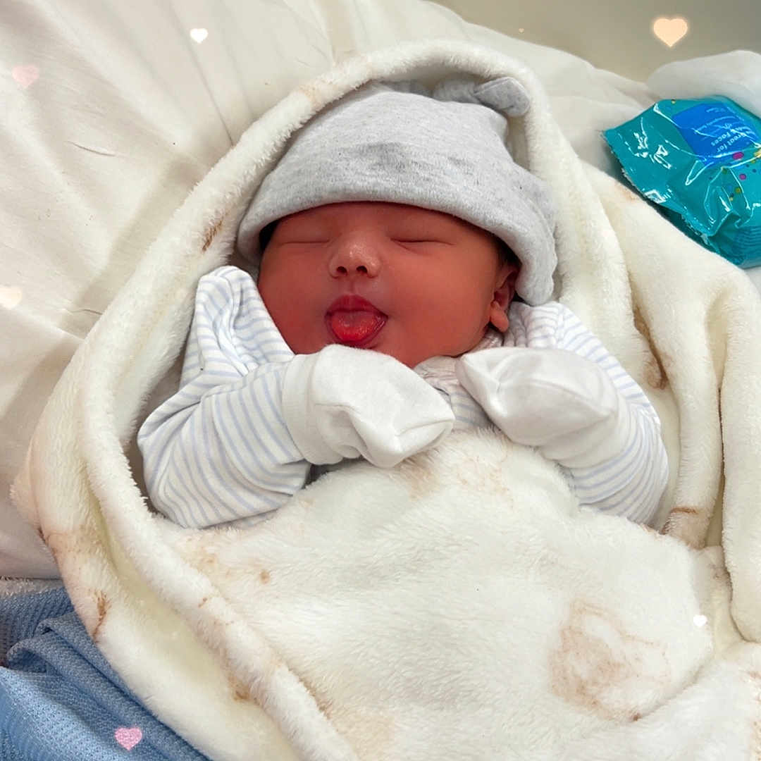 Riley-Alex is registered to the contest to win money with this photo: architecture, baby, bed, blanket, bonnet, building, clothing, crib, face, furniture, glove, hat, head, hospital, infantbed, newborn, person, photography, portrait, sleeping