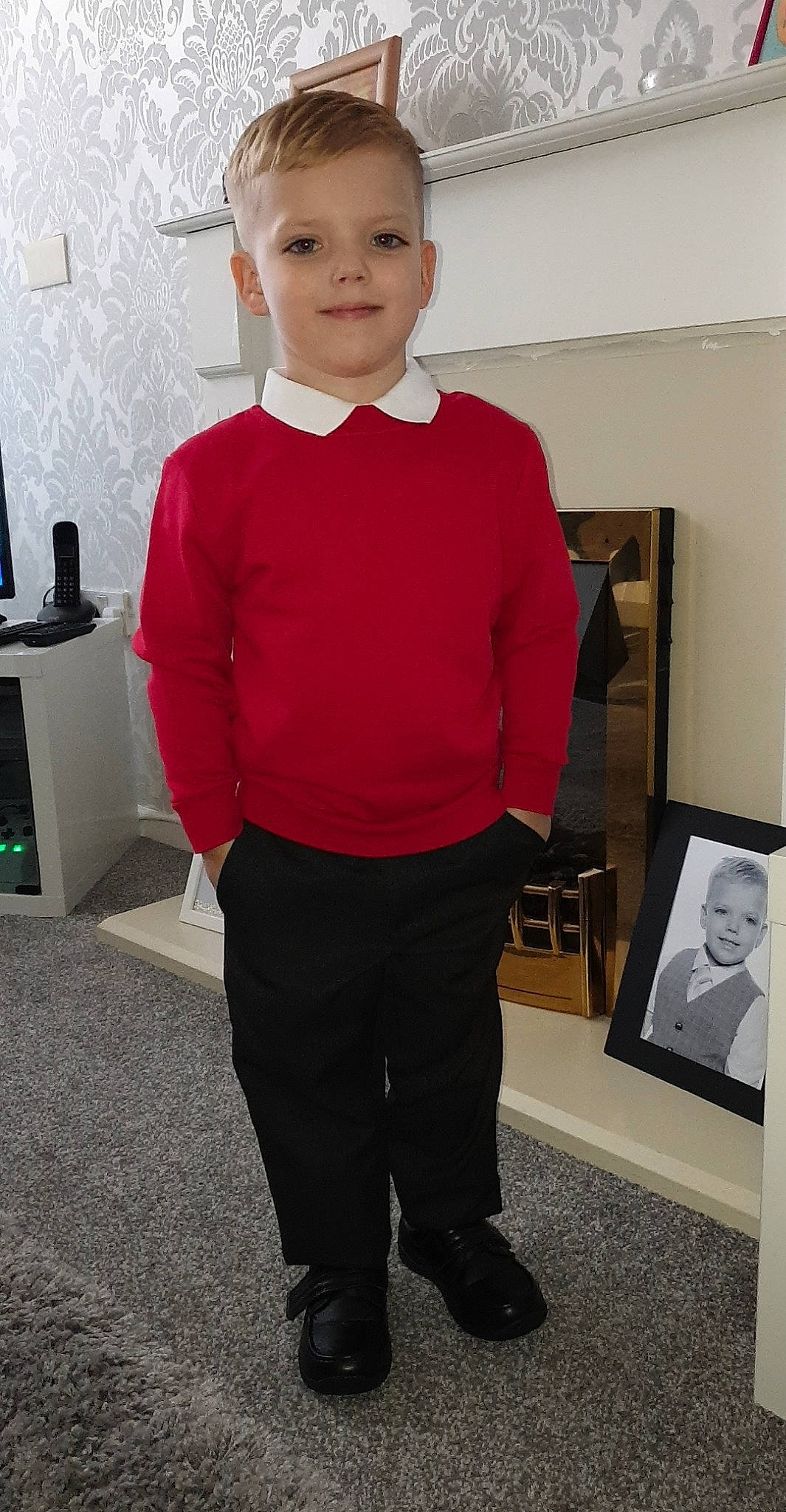 Kurtis is registered to the contest to win money with this photo: child, clothing, face, formal_wear, head, neck, outerwear, person, red, sleeve, smile, standing, suit, t_shirt, toddler