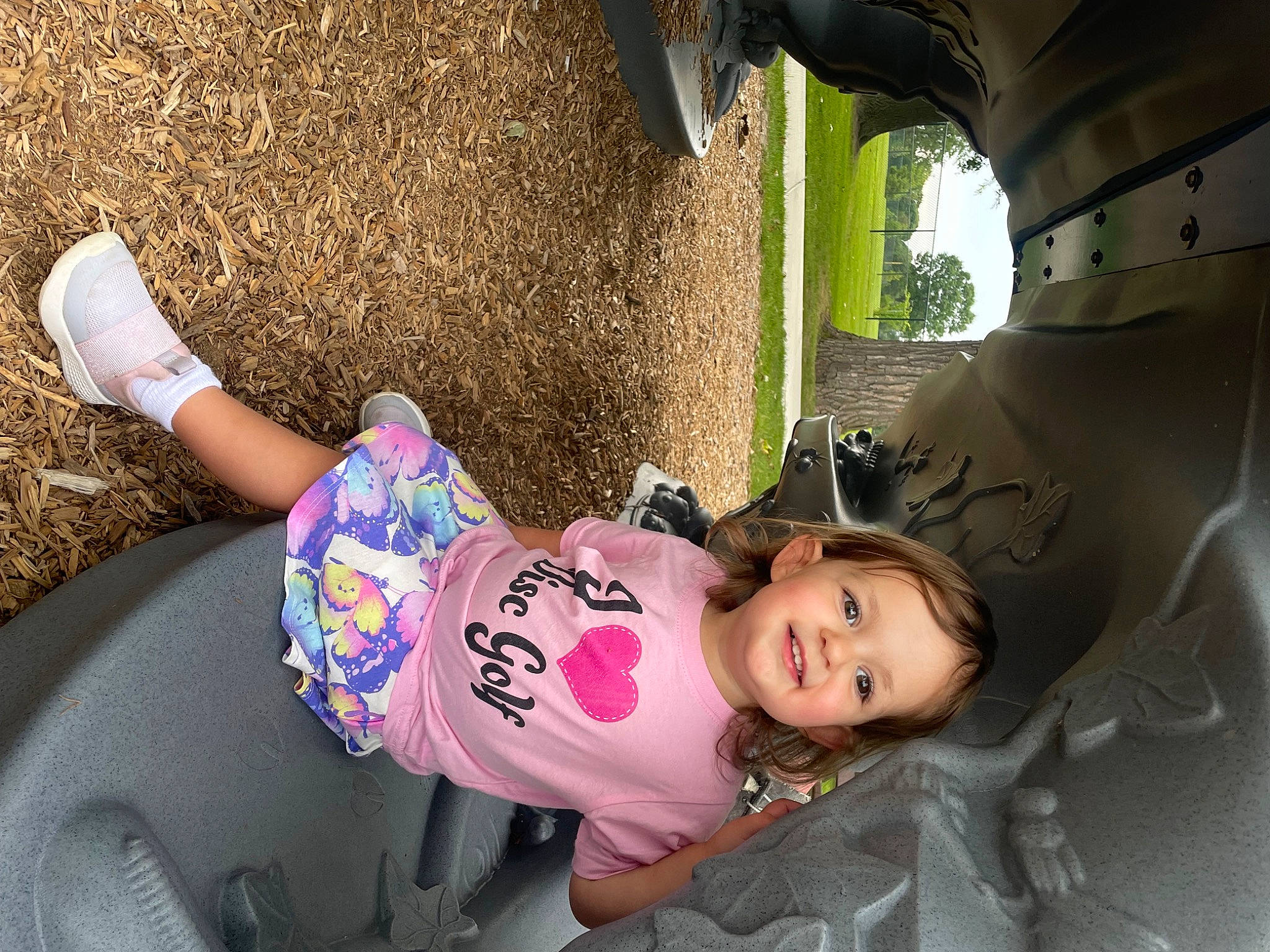 Emmy is registered to the contest to win money with this photo: baby, baby_toddler_clothing, child, fun, grass, joy, leisure, magenta, person, pink, plant, play, recreation, sitting, skin, sock, soil, tints_and_shades, toddler, tree