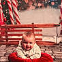 baby, child, infant, smile, red_cushion, candy_cane, wooden_bench, sleigh, bokeh, snow, cobblestone_floor, striped_shirt, portrait, holiday, christmas, cute, props, indoors, festive, background