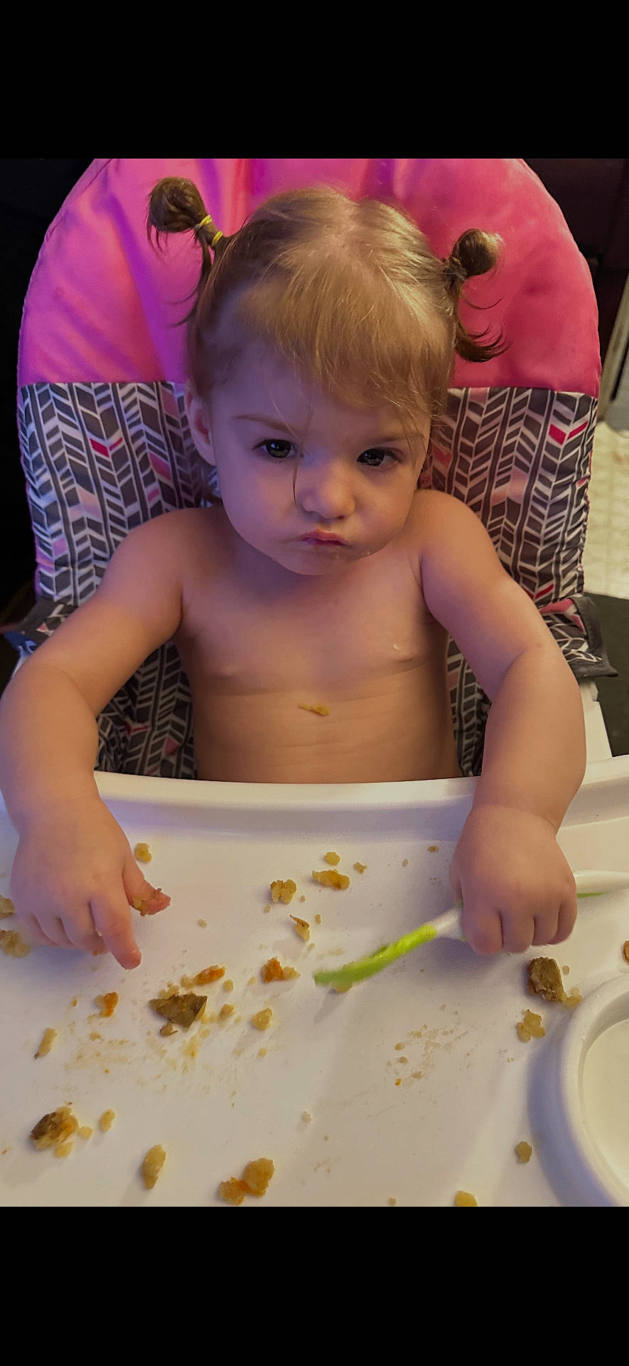 Ella is registered to the contest to win money with this photo: baby, child, cute, dining, eating, expression, face, food, funny, hair, hands, high_chair, indoor, meal, messy, pigtails, seat, spoon, toddler, tray
