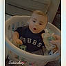 Dustin joined the competition — help win amazing prizes! baby, child, laundry_basket, indoor, couch, hand, pouch, curious, surprised, clothing, striped_pants, black_shirt, text_overlay, hearts, sitting, floor, person, portrait, infant, home