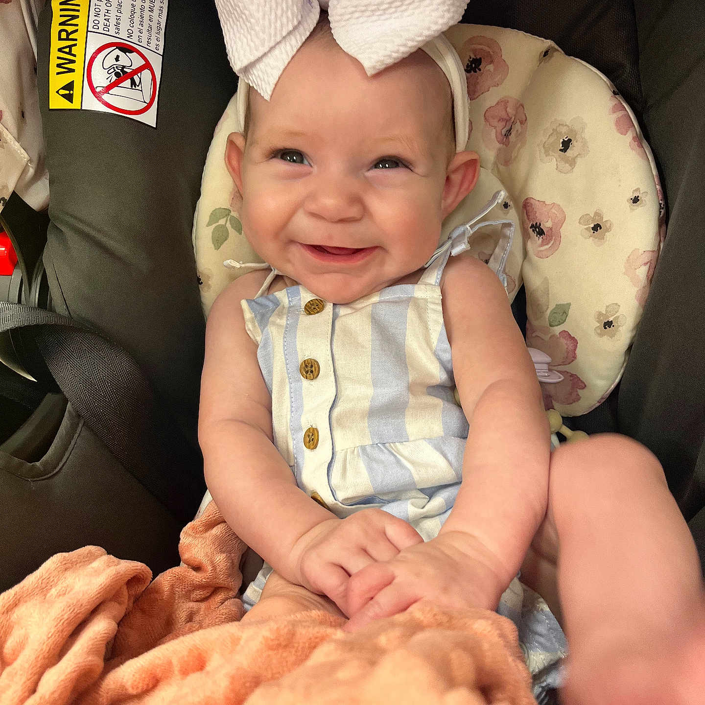 Kinsley is registered to the contest to win money with this photo: baby, babylaughing, baseballcap, blanket, bonnet, cap, clothing, couch, cushion, face, glove, happy, hat, head, homedecor, newborn, person, photography, portrait, smile