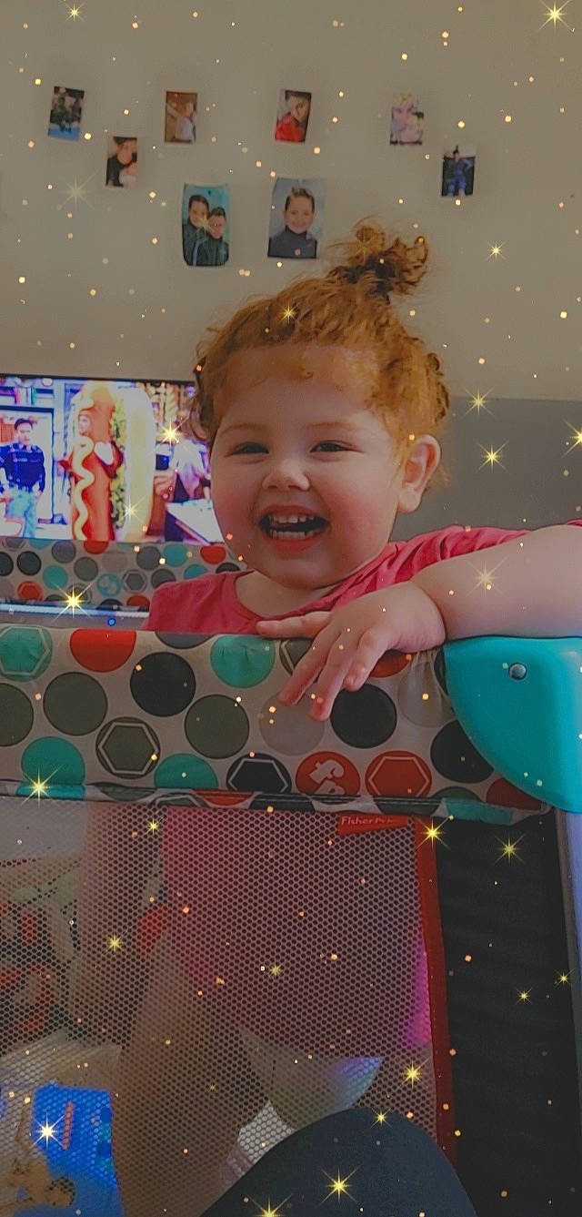 Lyah participe au concours pour gagner de l'argent avec cette photo : baby, baby_products, baby_toddler_clothing, blue, blurred, child, entertainment, event, facial_expression, fun, happy, human, joy, leisure, party_supply, pattern, person, pink, play, playground