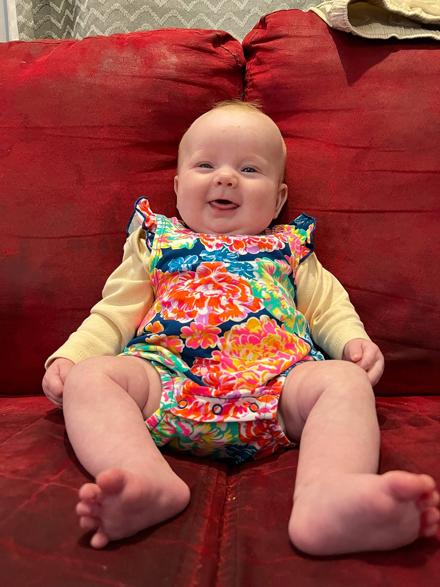 Penelope is registered to the contest to win money with this photo: baby, baby_toddler_clothing, cheek, comfort, dress, eye, finger, fun, happy, head, human_leg, lap, mouth, person, pink, skin, sleeve, smile, t_shirt, thigh