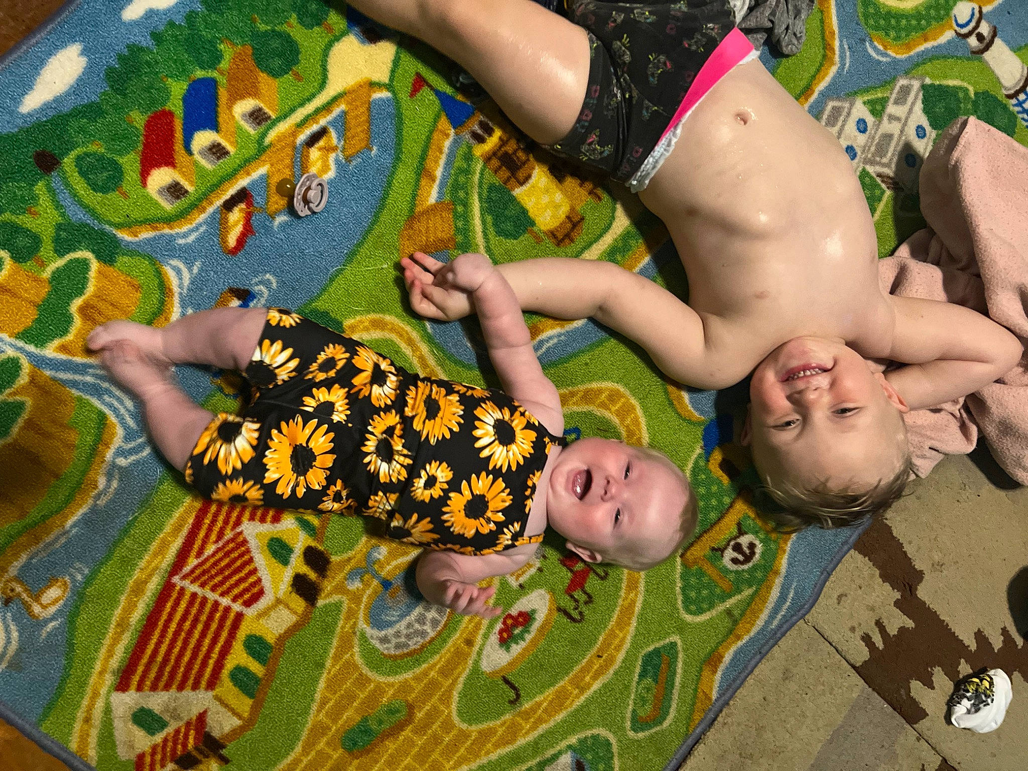 Parker is registered to the contest to win money with this photo: art, baby, barechested, chest, child, flooring, fun, grass, green, happy, human_leg, joy, leaf, leisure, pattern, people_in_nature, person, play, room, thigh
