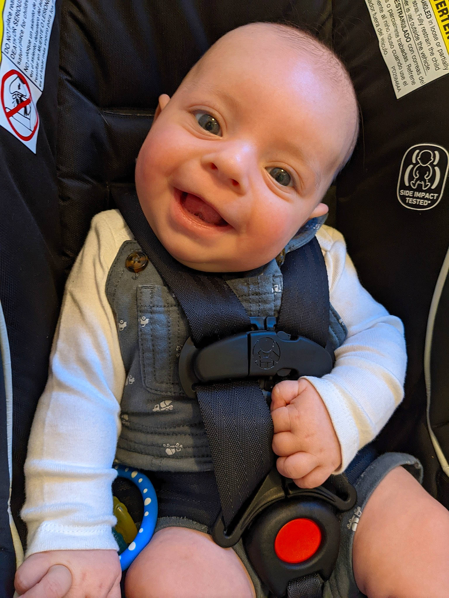 Nicolas is registered to the contest to win money with this photo: auto_part, baby, baby_carriage, baby_products, baby_safety, baby_toddler_clothing, cheek, child, comfort, electric_blue, happy, nail, person, personal_protective_equipment, service, sitting, skin, sleeve, smile, thumb