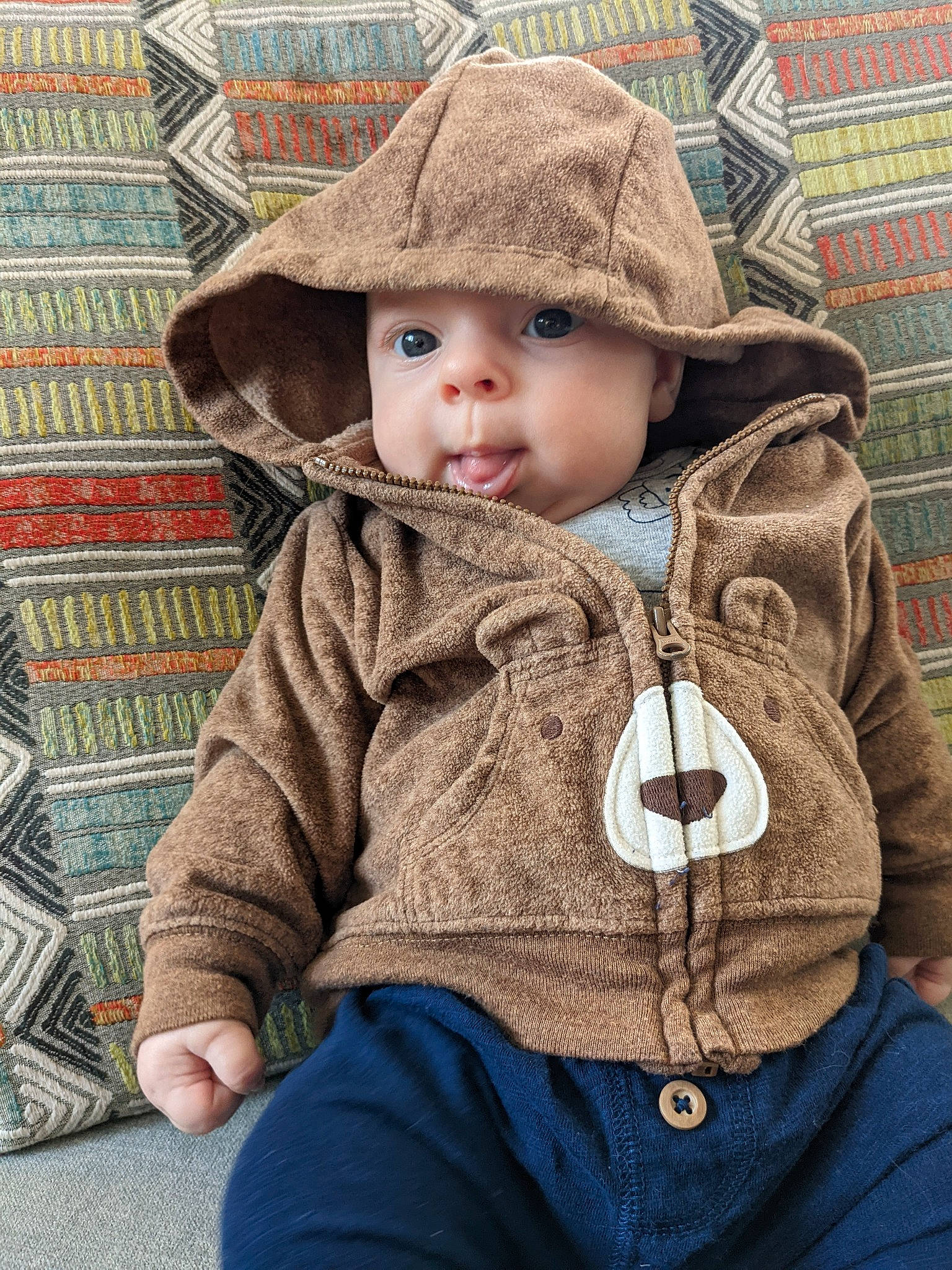 Nicolas is registered to the contest to win money with this photo: baby, baby_toddler_clothing, cap, cheek, eye, face, head, headgear, headwear, human_body, lip, nose, organ, outerwear, person, photograph, product, skin, sleeve, standing