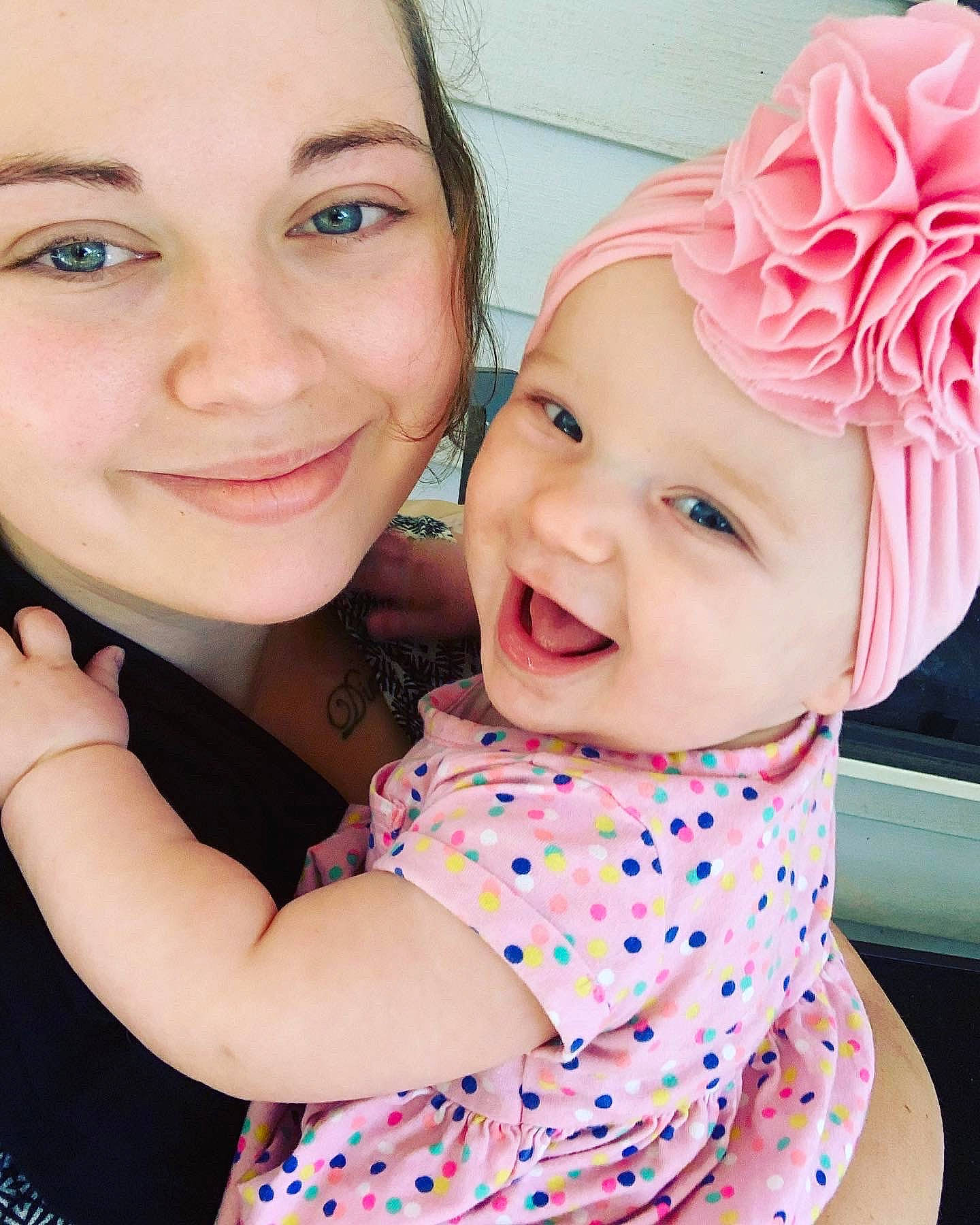 Iris joined the competition — help win amazing prizes! baby_toddler_clothing, cheek, chin, clothing, face, facial_expression, fun, gesture, hairstyle, happy, headwear, iris, joy, lip, neck, person, photograph, pink, product, skin