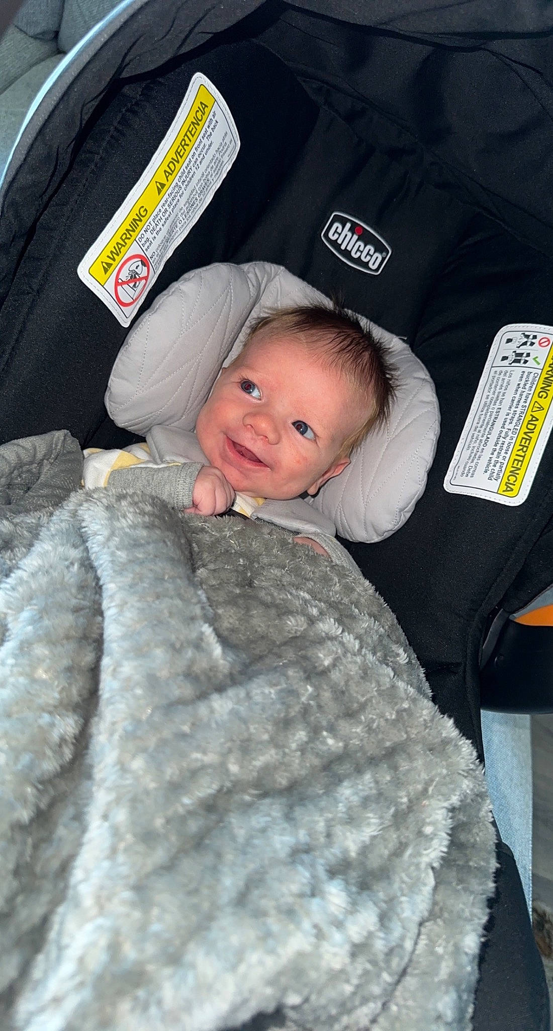 Hudson is registered to the contest to win money with this photo: baby, baby_carriage, baby_products, baby_toddler_clothing, car_seat, cheek, child, comfort, fur, fur_clothing, joy, linens, person, sitting, skin, smile, toddler, wool