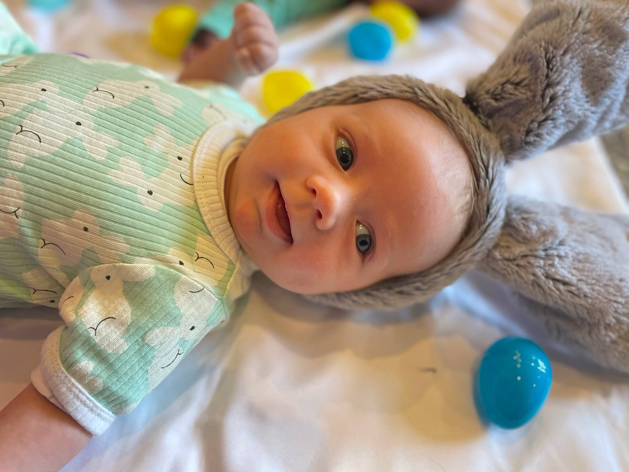 Hudson is registered to the contest to win money with this photo: baby, cheek, child, close_up, doll, eyelash, fashion_accessory, fawn, fun, fur, happy, headgear, iris, leisure, nose, person, play, skin, toddler, toy