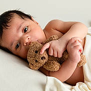 Tyler participe au concours pour gagner de l'argent avec cette photo : baby, infant, teddy_bear, soft_blanket, white_background, close_up, cute, child, sleepy, wrapped, skin, hand, toy, peaceful, lying_down, portrait, newborn, comfort, cuddle, resting