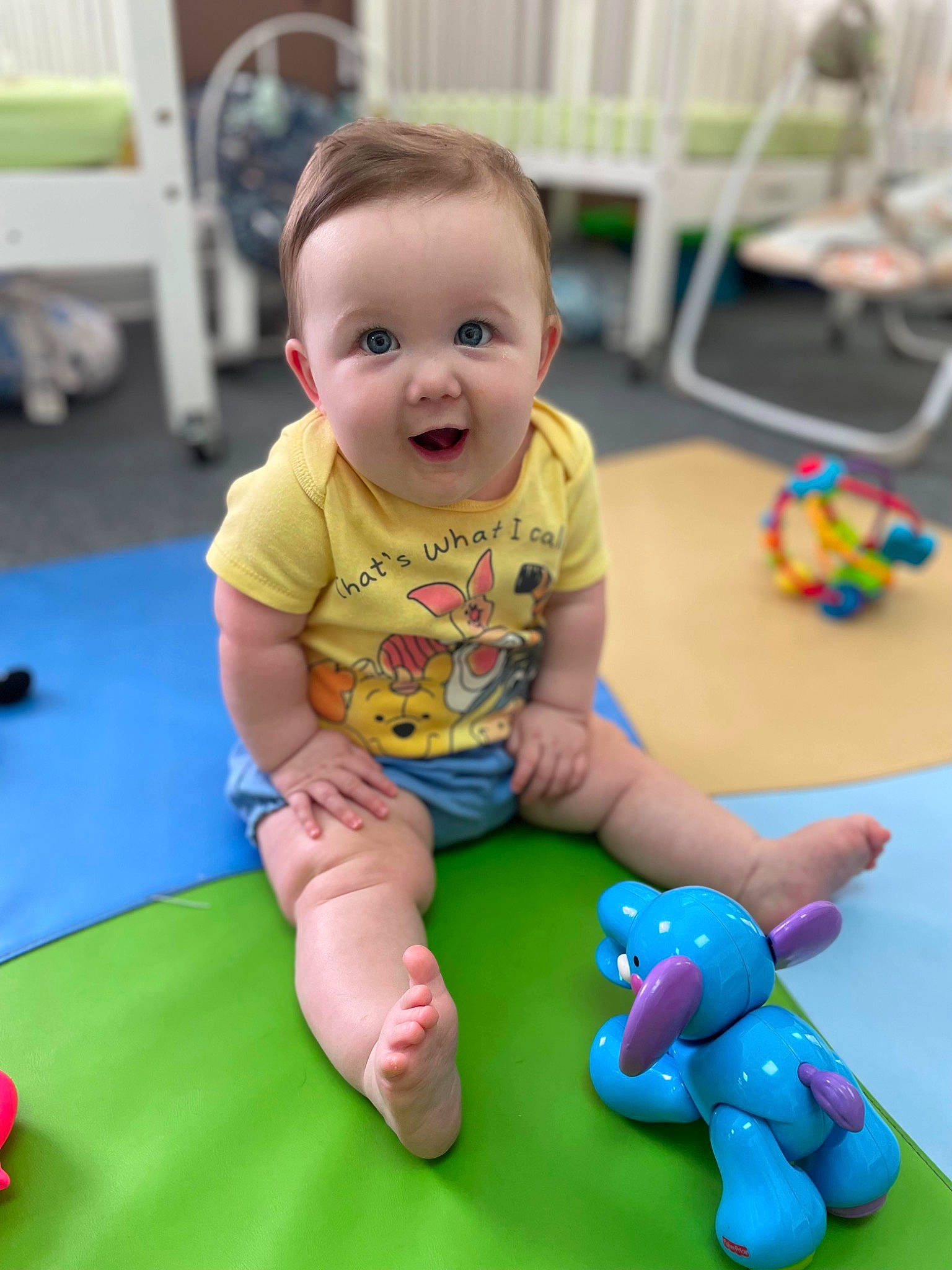 Alli joined the competition — help win amazing prizes! baby, baby_playing_with_toys, baby_toddler_clothing, child, electric_blue, floor, flooring, fun, happy, joint, leisure, person, play, room, shorts, sitting, skin, smile, standing, toddler