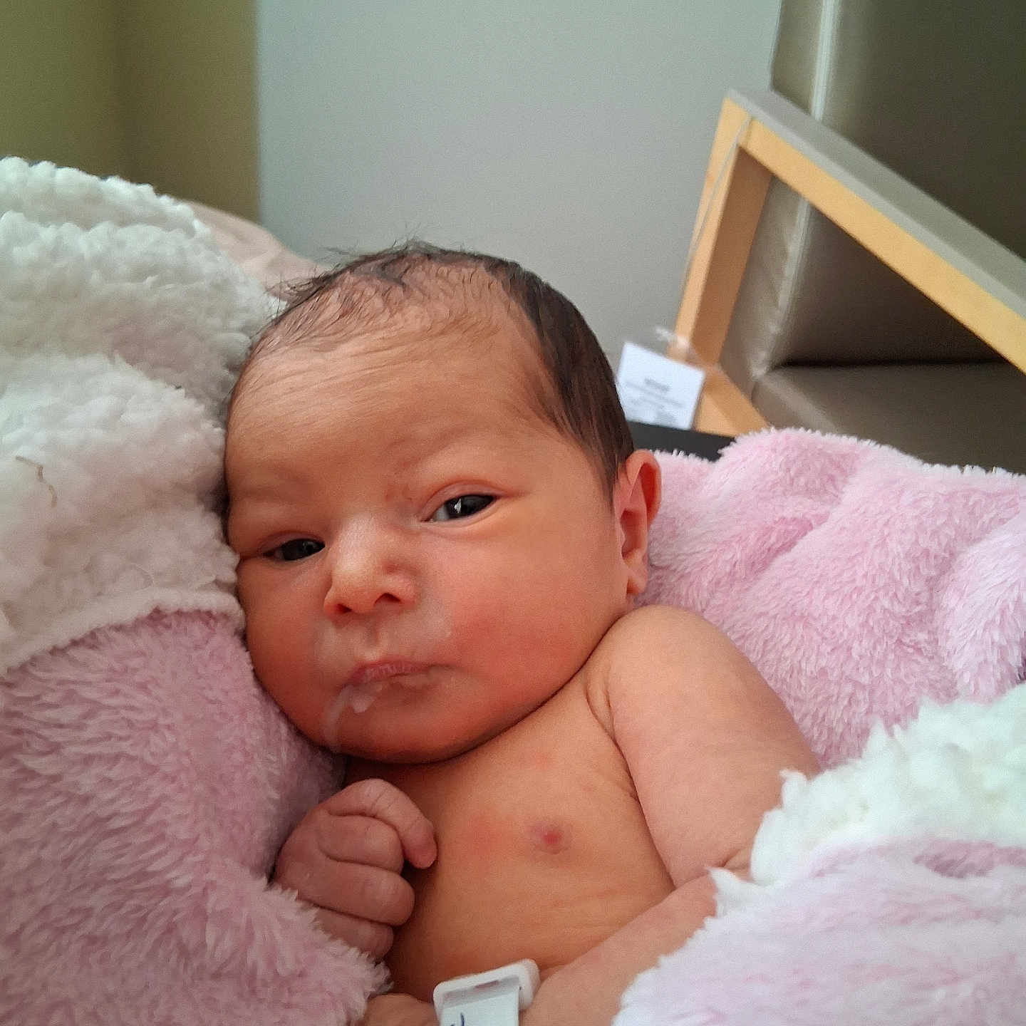 Aurora joined the competition — help win amazing prizes! newborn, baby, infant, blanket, hospital_bracelet, pink, white, skin, face, hand, indoor, resting, cozy, curious, pout, soft_texture, head, person, portrait, closeup