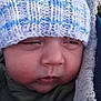 Jeremiah joined the competition — help win amazing prizes! baby, close_up, face, knitted_hat, blue_hat, white_hat, blanket, winter_clothing, sleepy, outdoor, child, portrait, soft_texture, warm, cute, person, headwear, infant, cozy, snuggled