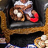 Deandre joined the competition — help win amazing prizes! baby, child, baseball, baseball_glove, baseball_balls, red_socks, black_leather_chair, gold_chair_detail, basket, banner, sports_theme, smiling, portrait, indoor, cute, clothing, happy, person, floor, decor