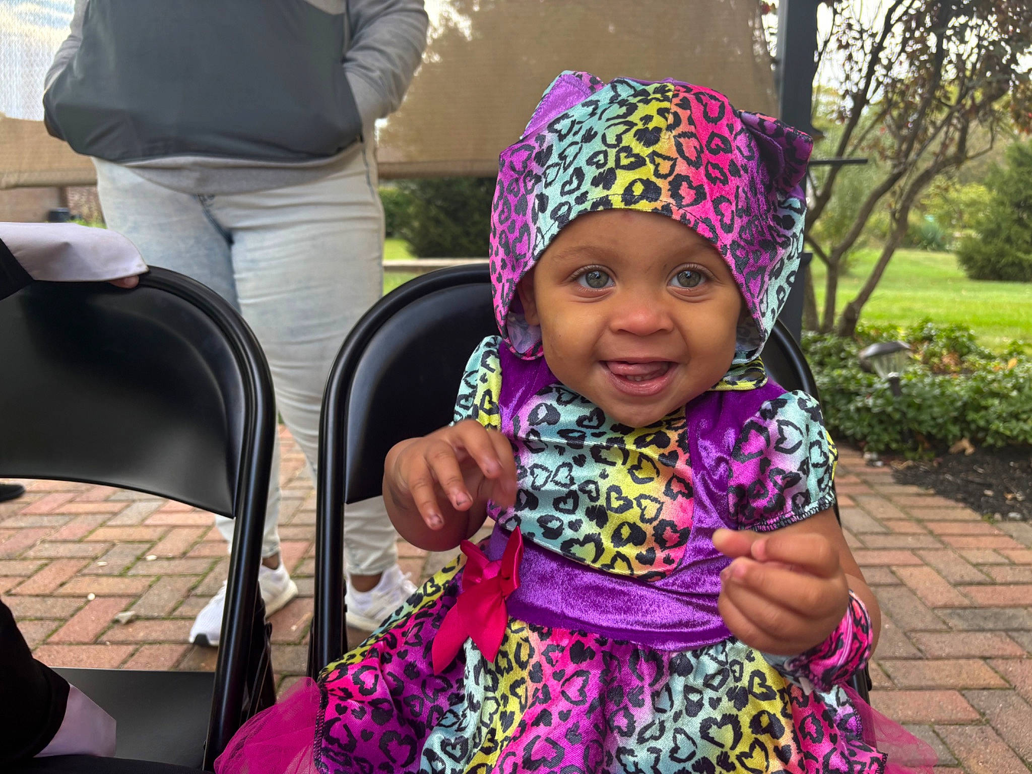 Marlee is registered to the contest to win money with this photo: chair, child, event, fashion_accessory, fun, grass, green, happy, headgear, headwear, joy, leisure, magenta, person, pink, plant, purple, recreation, smile, toddler