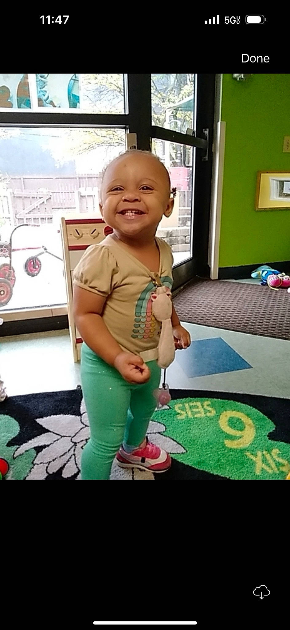 Marlee joined the competition — help win amazing prizes! baby, baby_toddler_clothing, child, flooring, fun, grass, happy, joy, leisure, linens, magenta, pattern, person, picture_frame, play, room, smile, standing, t_shirt, toddler