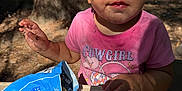 Lillian joined the competition — help win amazing prizes! toddler, child, dirty_face, pink_shirt, cowgirl, snack_bag, outdoor, picnic_table, forest, tree, sunlight, dirt, hand, curious, messy, food, nature, summer, young_child, portrait