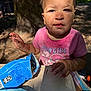 toddler, child, dirty_face, pink_shirt, cowgirl, snack_bag, outdoor, picnic_table, forest, tree, sunlight, dirt, hand, curious, messy, food, nature, summer, young_child, portrait