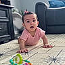Leonna joined the competition — help win amazing prizes! baby, child, crawling, pink_clothing, bow, toy, floor_mat, indoor, furniture, sofa, cabinet, person, curious, young_child, home, carpet, infant, cute, playtime, portrait